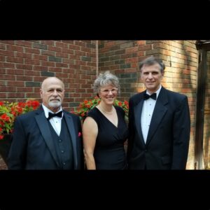 The Don Disantis Trio standing in evening wear